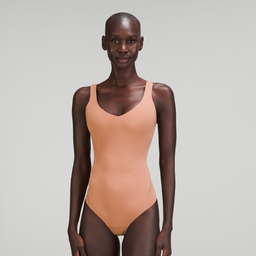 Lululemon Athletica Tan and Pink Bodysuit